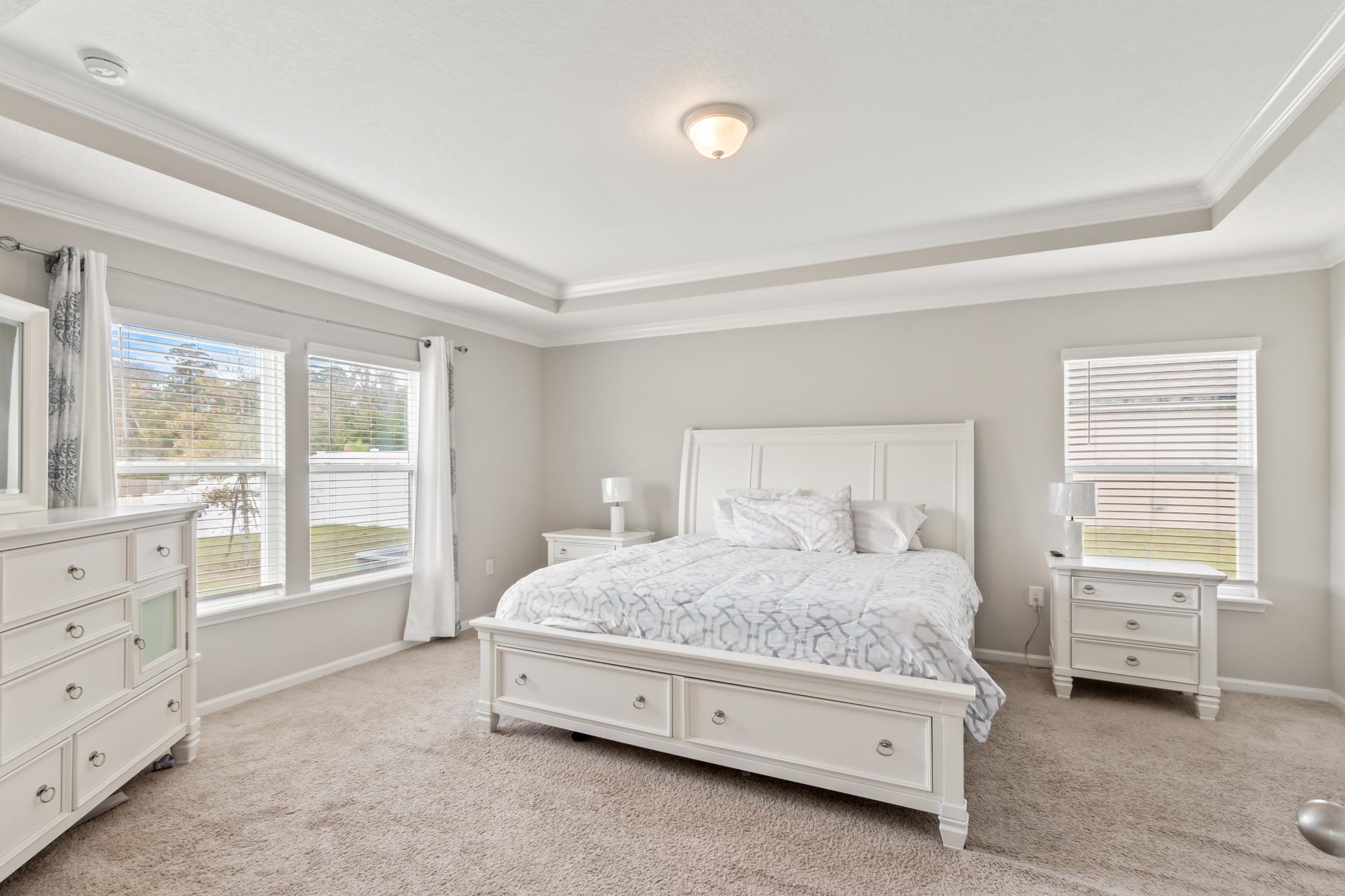 392 South Hamilton Springs Road St. Augustine, FL 32084 - Photo 4 of 29 a bedroom with a bed and a window