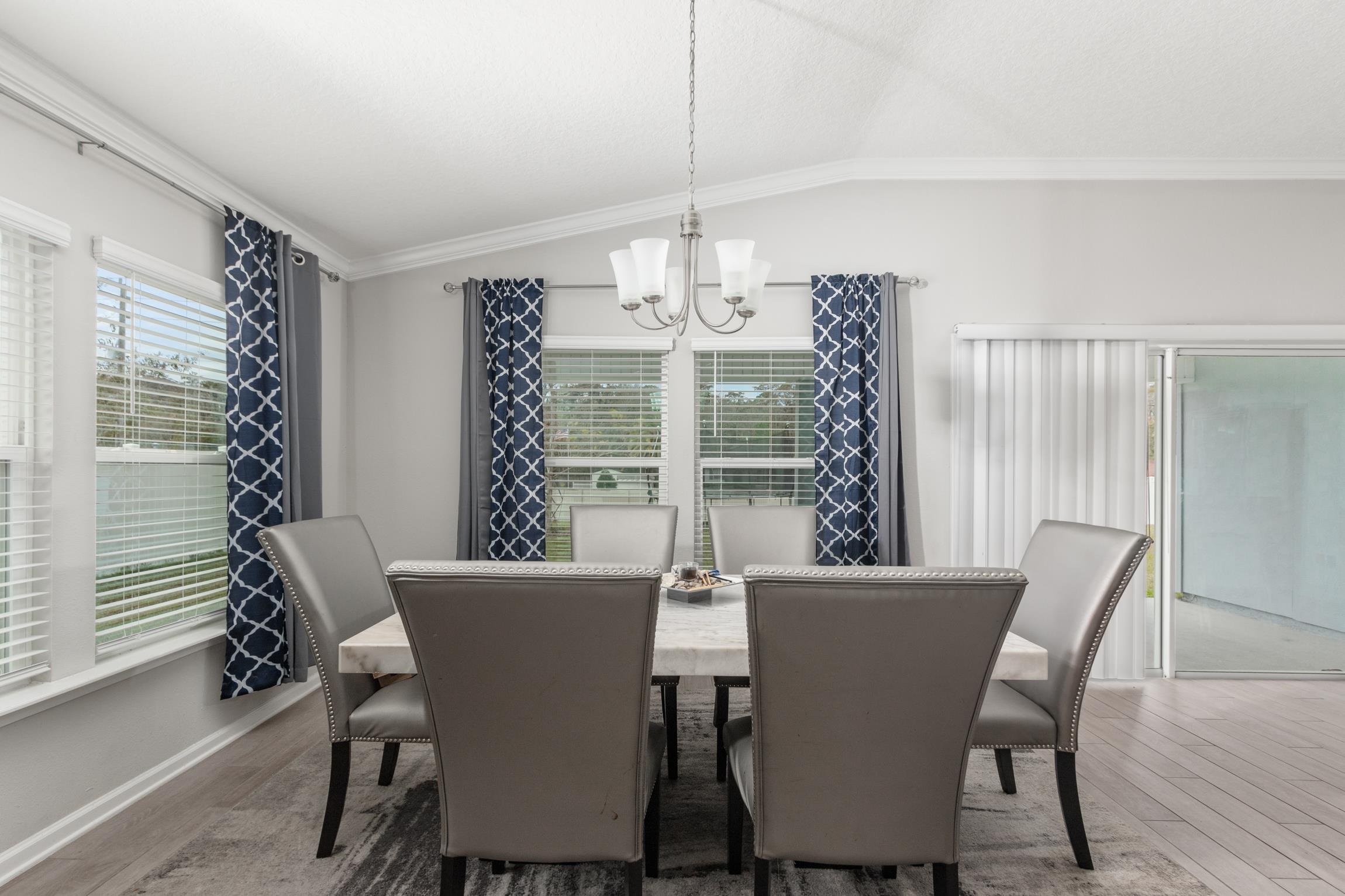 392 South Hamilton Springs Road St. Augustine, FL 32084 - Photo 9 of 29 a view of a dining room with furniture window and wooden floor