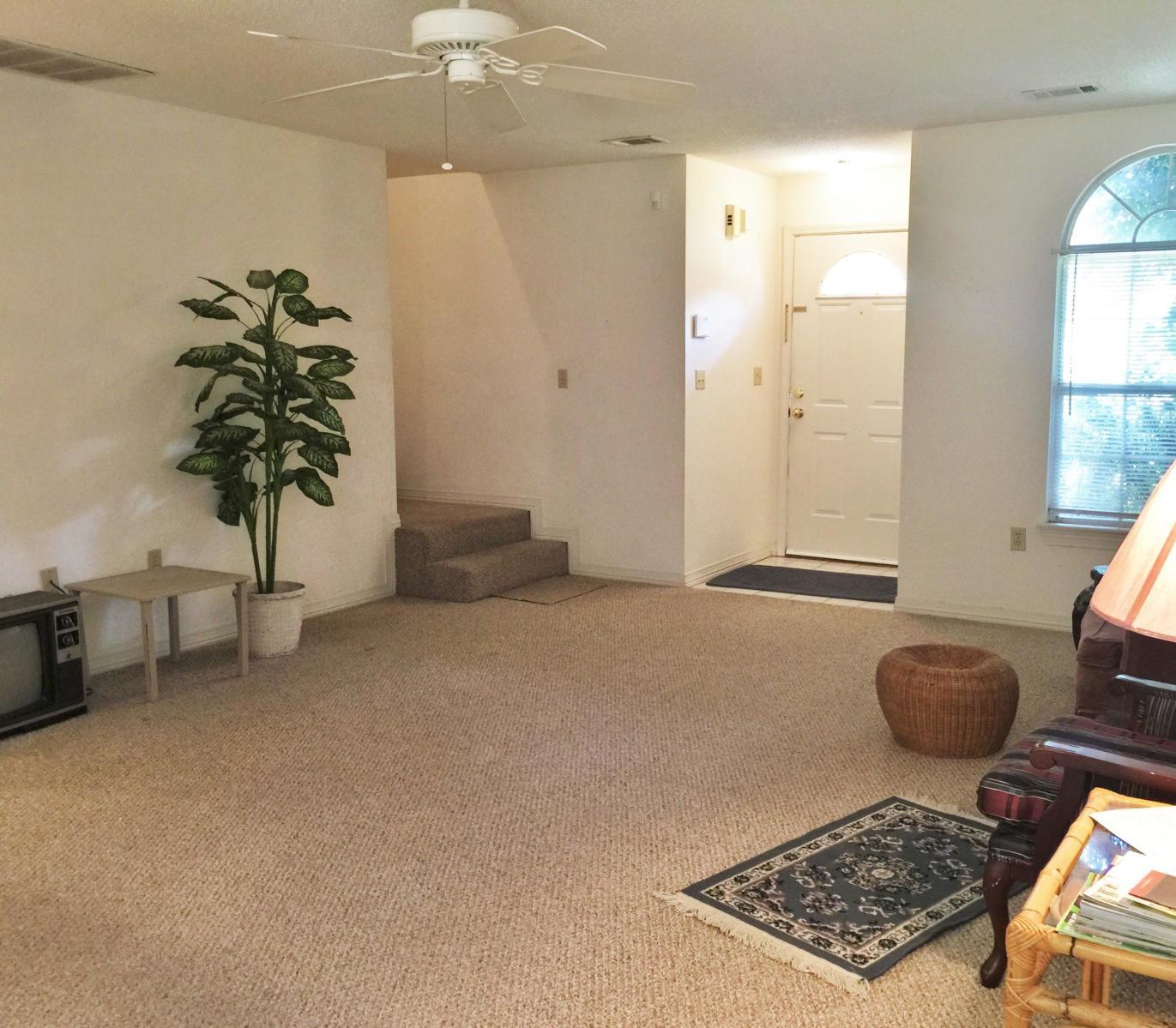 2807 Ping Lane Crestview, FL 32539 - Photo 2 of 28 a living room with furniture and a potted plant
