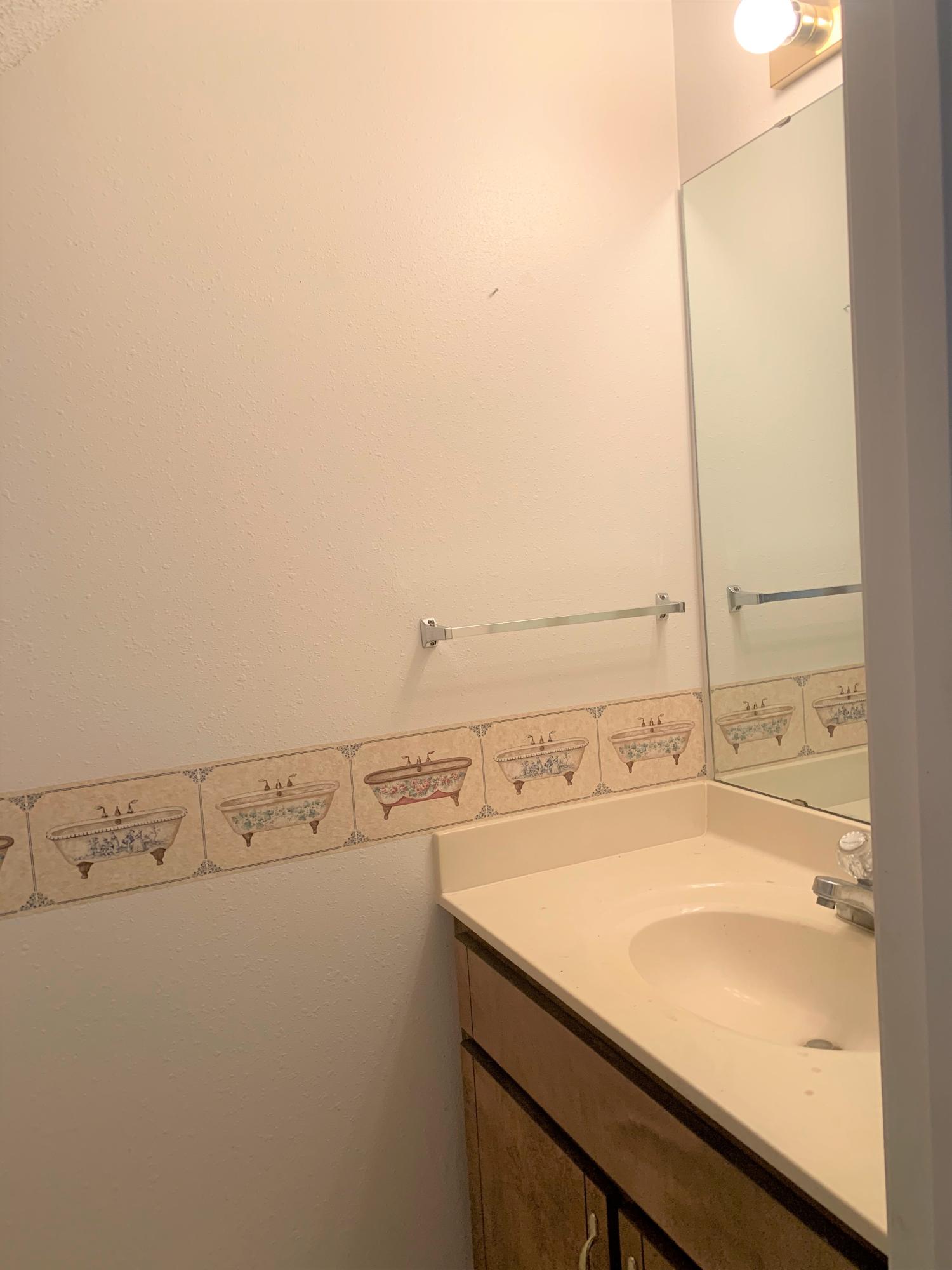 2807 Ping Lane Crestview, FL 32539 - Photo 11 of 28 a bathroom with a sink and a mirror
