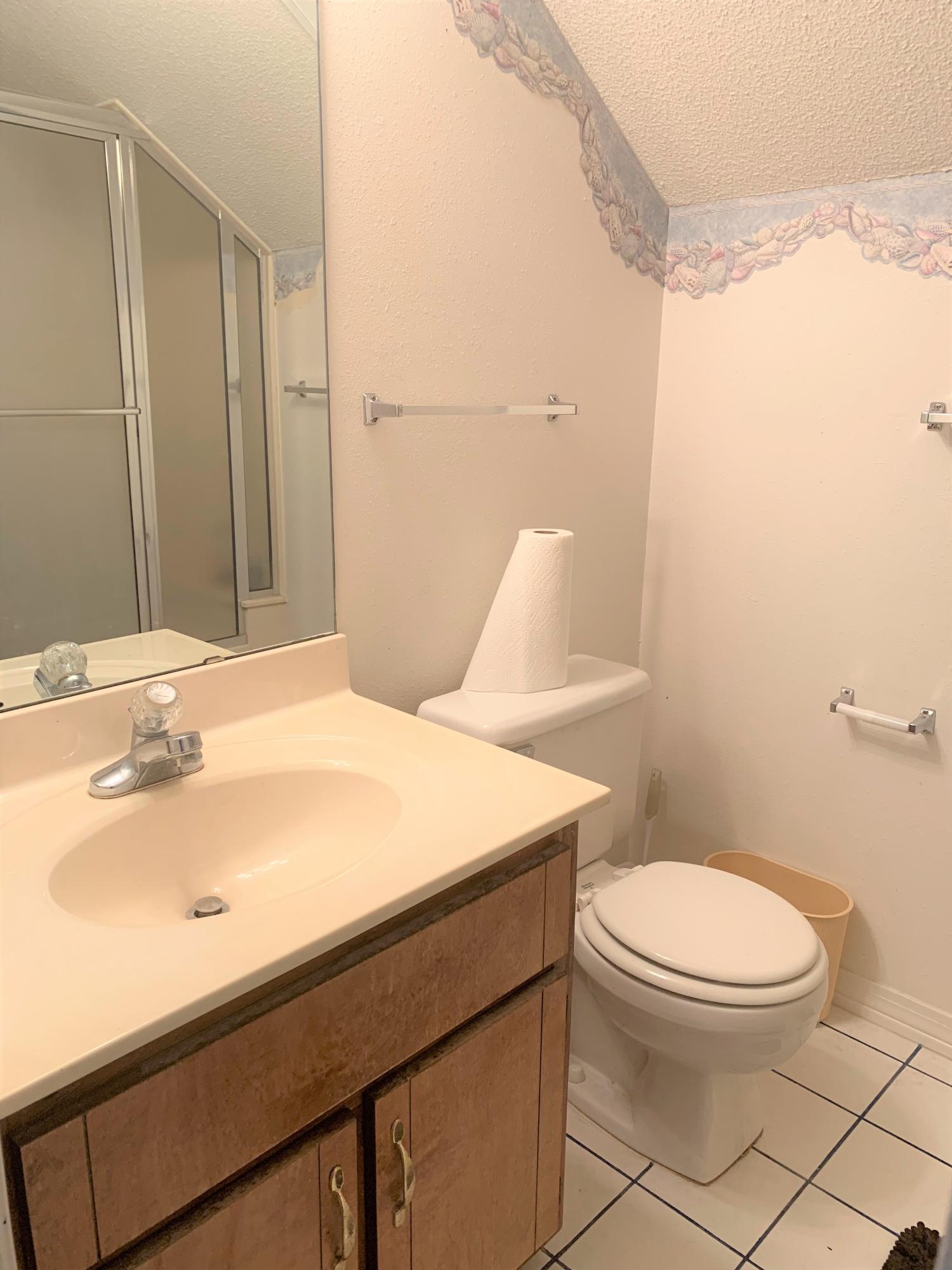 2807 Ping Lane Crestview, FL 32539 - Photo 7 of 28 a bathroom with a sink a toilet and shower