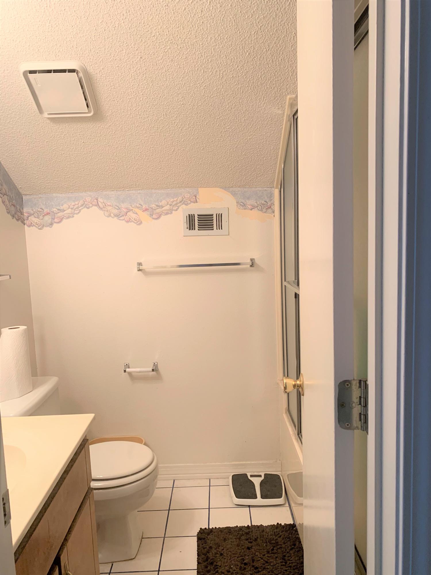2807 Ping Lane Crestview, FL 32539 - Photo 8 of 28 a bathroom with a toilet a sink and a mirror