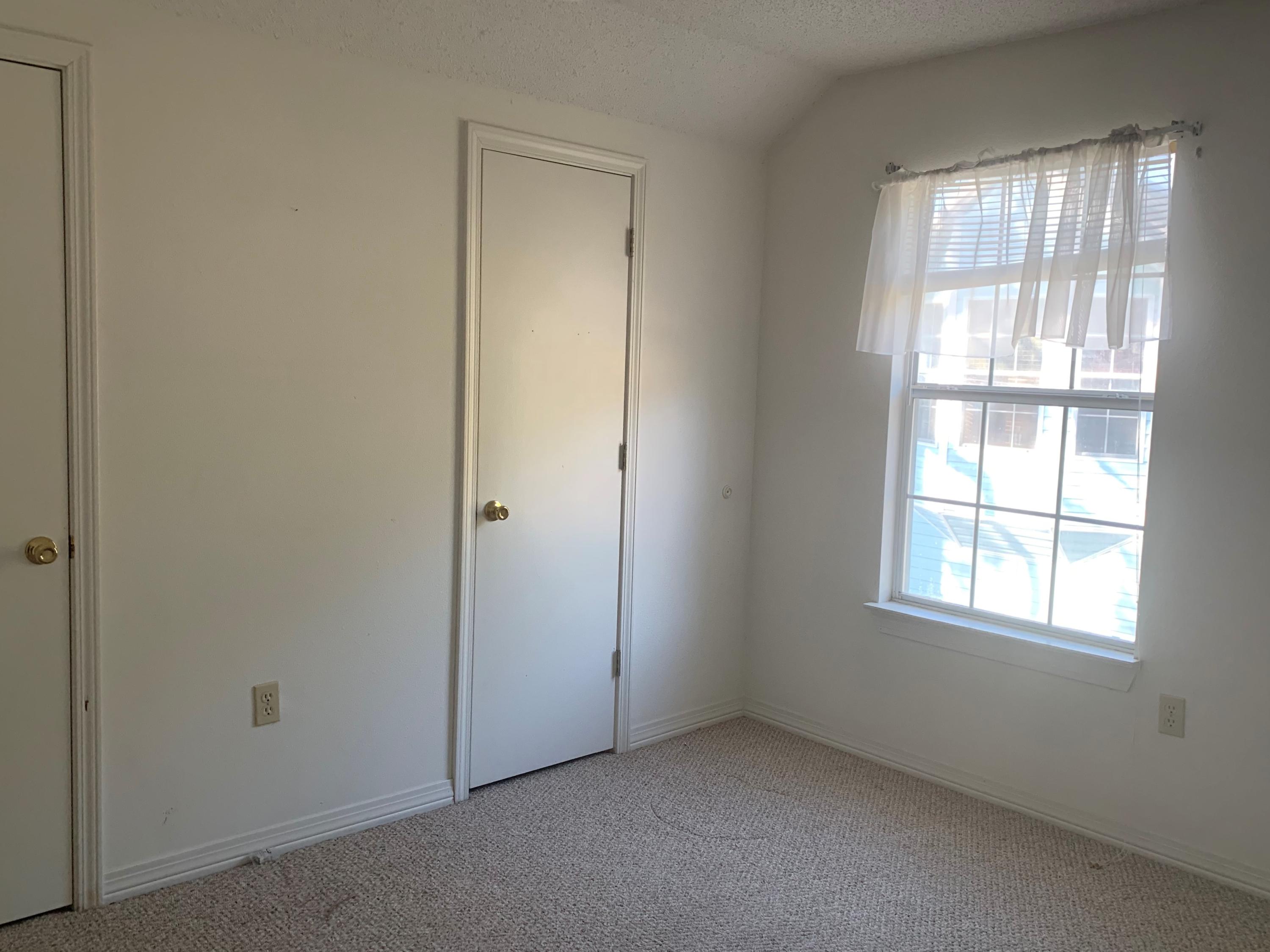 2807 Ping Lane Crestview, FL 32539 - Photo 9 of 28 an empty room with windows and closet