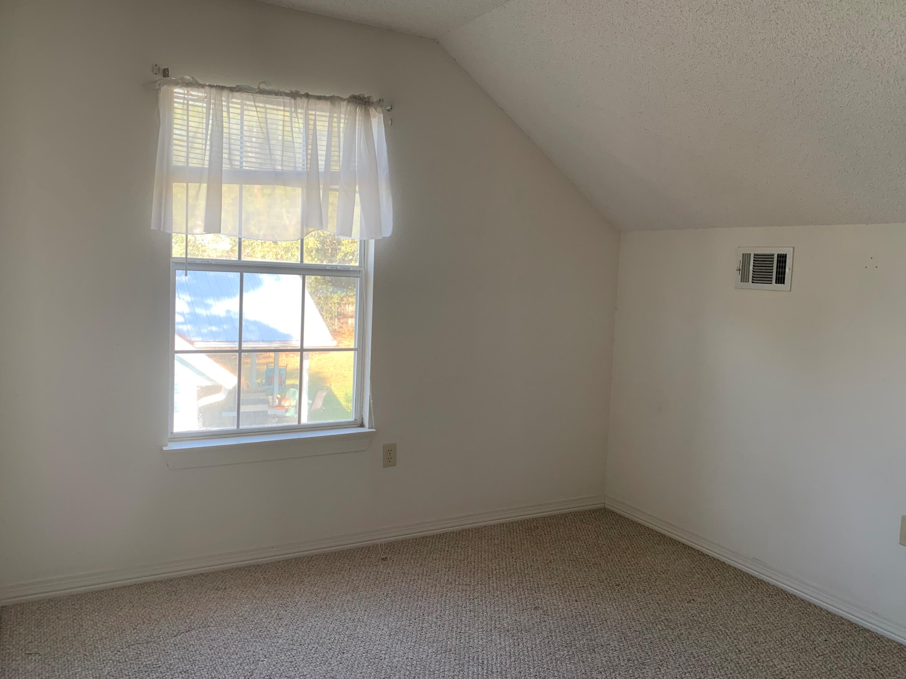 2807 Ping Lane Crestview, FL 32539 - Photo 10 of 28 an empty room with a window