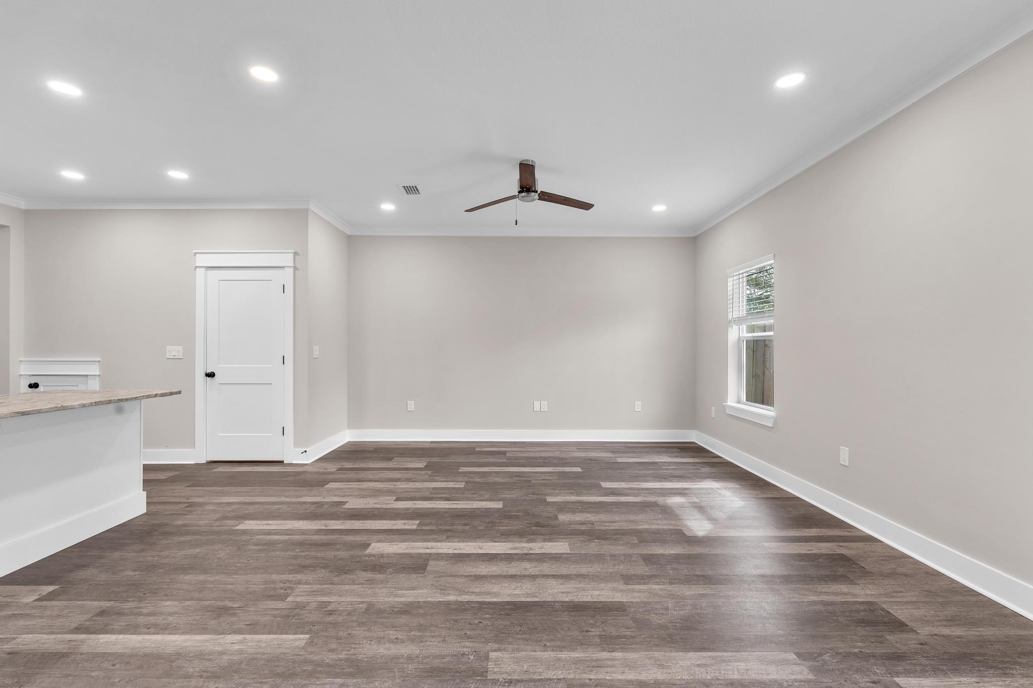 2 Praiseworthy Drive Valparaiso, FL 32580 - Photo 13 of 36 a view of an empty room with wooden floor and a window
