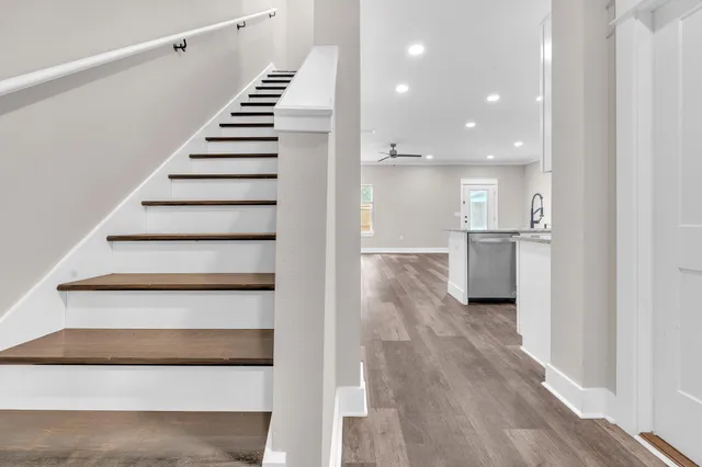 a view of entryway and hall with wooden floor
