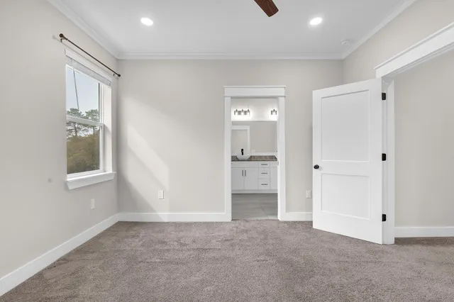 an empty room with windows and closet