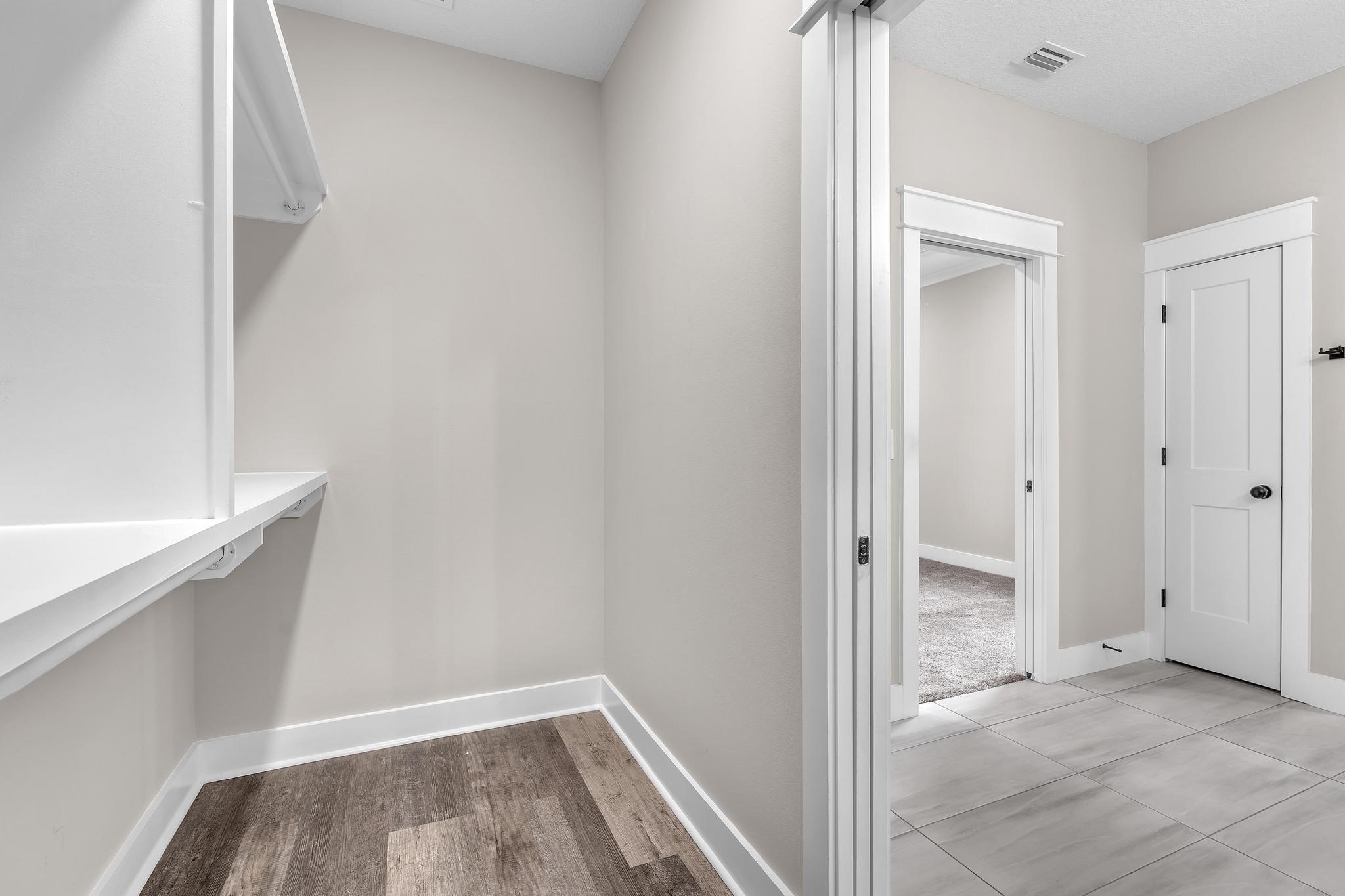 2 Praiseworthy Drive Valparaiso, FL 32580 - Photo 22 of 36 a view of a hallway with wooden floor and closet