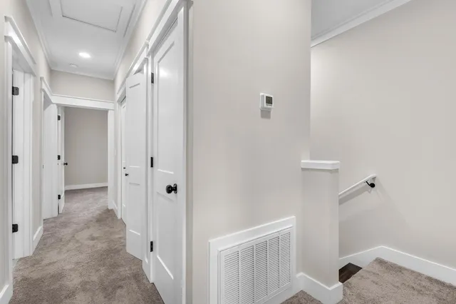 a view of a hallway with closet and entryway