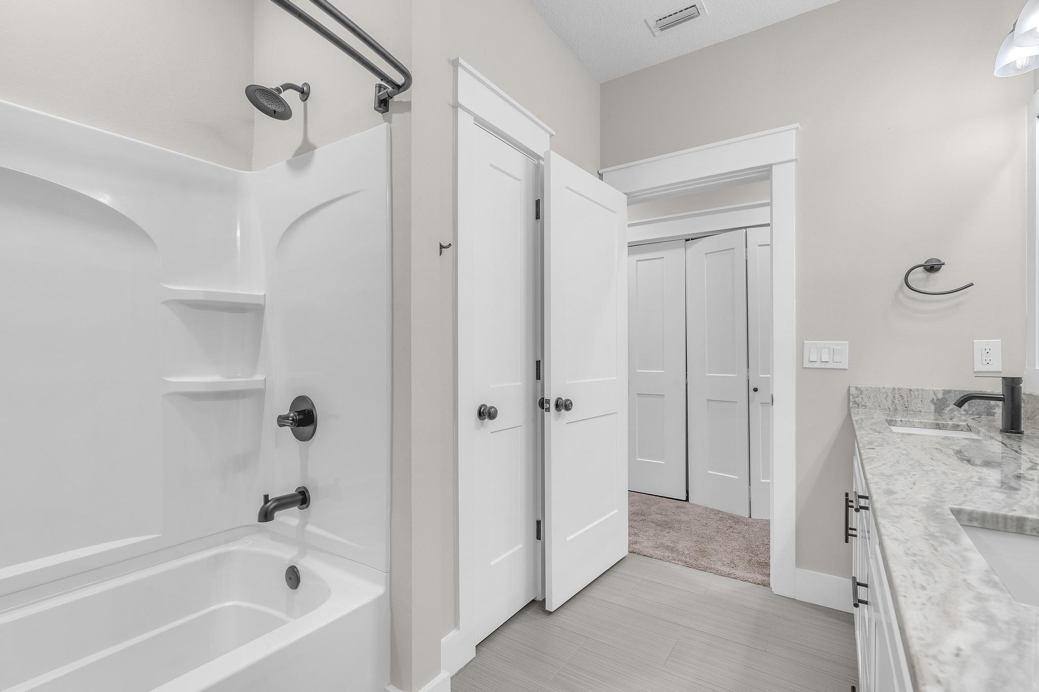 2 Praiseworthy Drive Valparaiso, FL 32580 - Photo 27 of 36 a bathroom with a tub sink vanity and shower