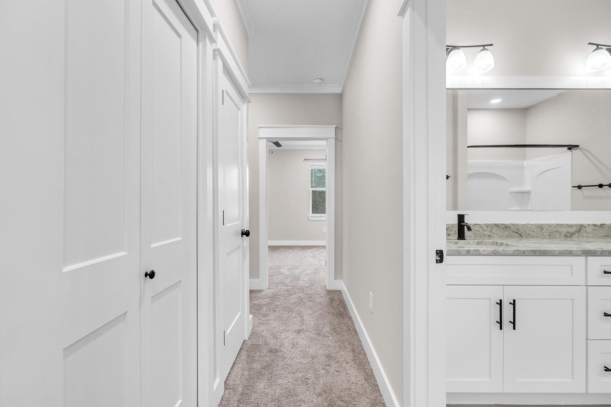 2 Praiseworthy Drive Valparaiso, FL 32580 - Photo 32 of 36 a view of a hallway with wooden floor and staircase
