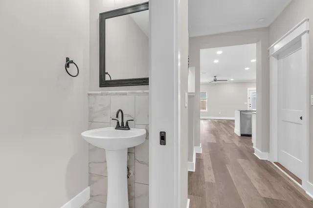 a bathroom with a sink a mirror and a shower