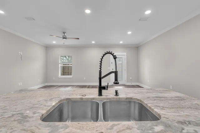 a kitchen with a sink and a window