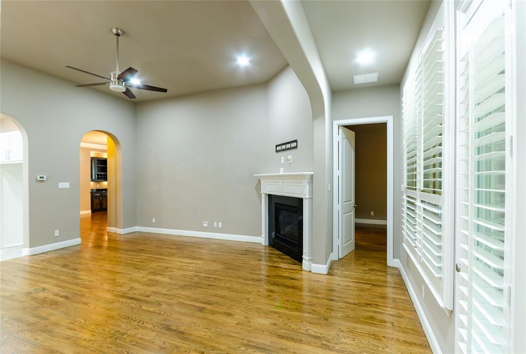 1863 Audubon Pond Way Allen, TX 75013 - Photo 11 of 40 a view of an empty room with a fireplace and a window
