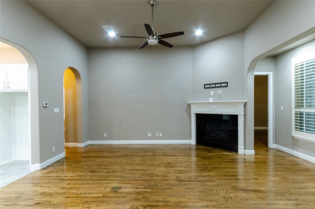 1863 Audubon Pond Way Allen, TX 75013 - Photo 12 of 40 a view of a livingroom with a fireplace and window