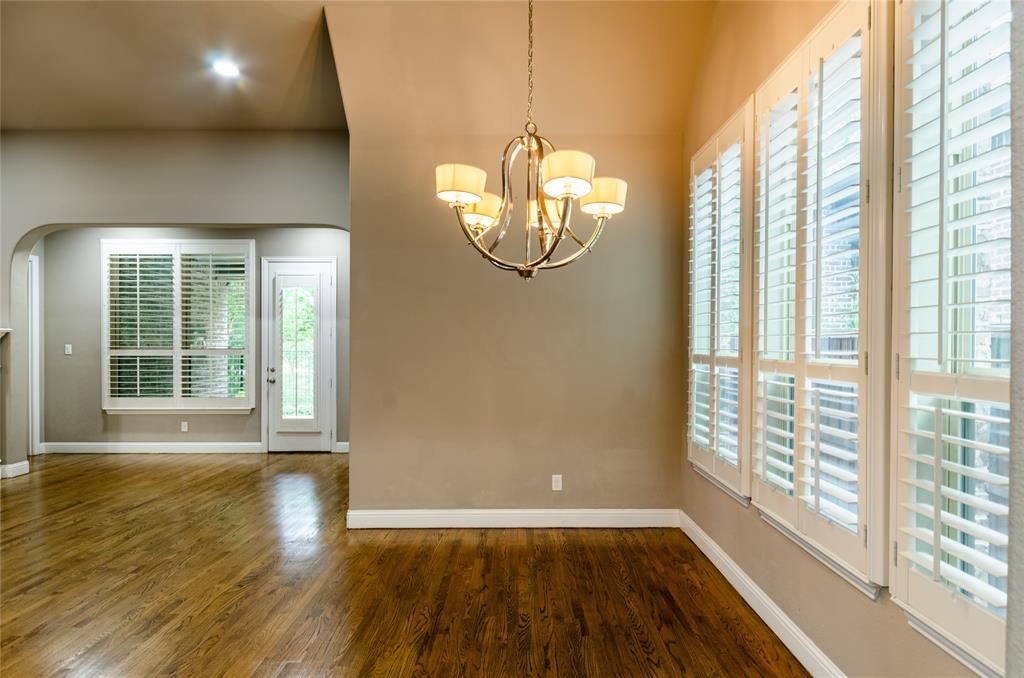 1863 Audubon Pond Way Allen, TX 75013 - Photo 15 of 40 a view of empty room with wooden floor and fan