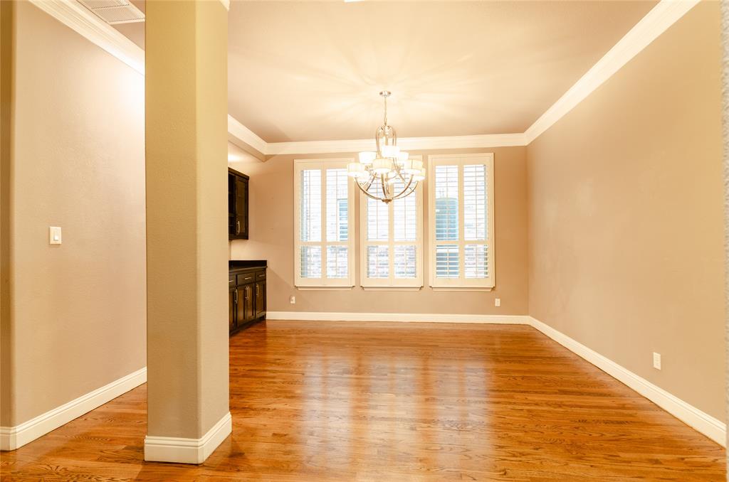 1863 Audubon Pond Way Allen, TX 75013 - Photo 18 of 40 a view of an empty room with wooden floor and a window