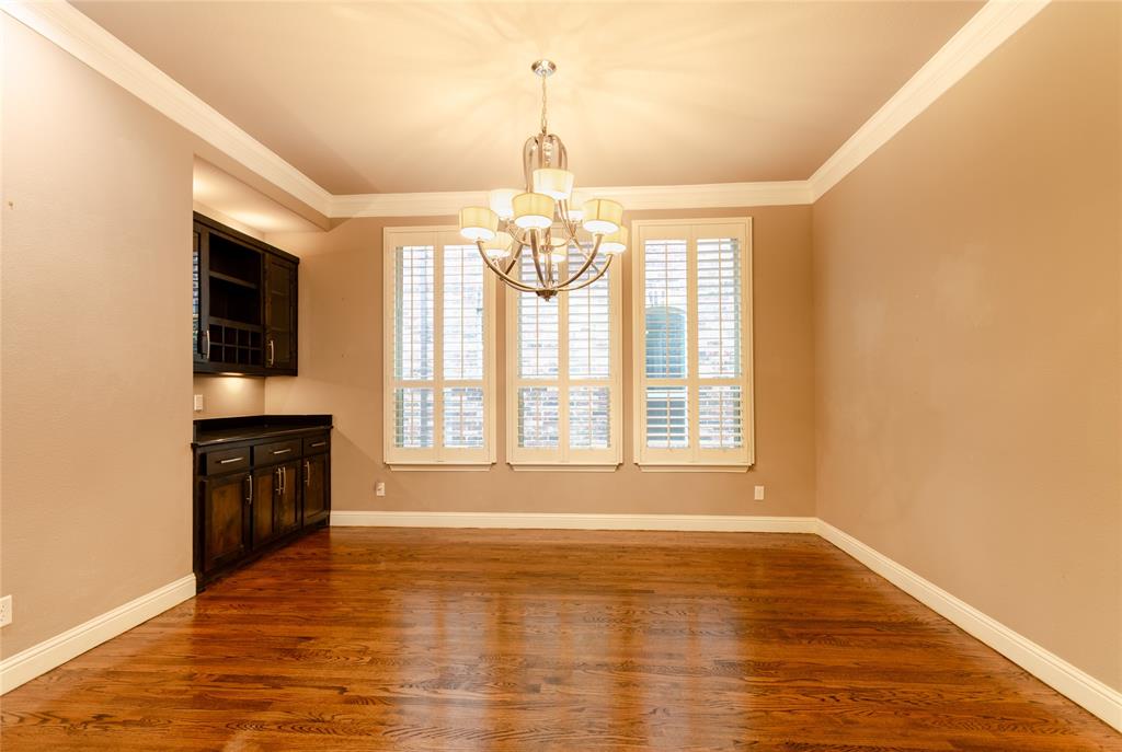 1863 Audubon Pond Way Allen, TX 75013 - Photo 19 of 40 a view of an empty room with a window and wooden floor