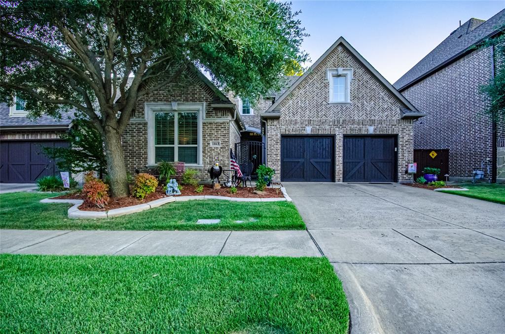 1863 Audubon Pond Way Allen, TX 75013 - Photo 2 of 40 a front view of a house with a yard and garage