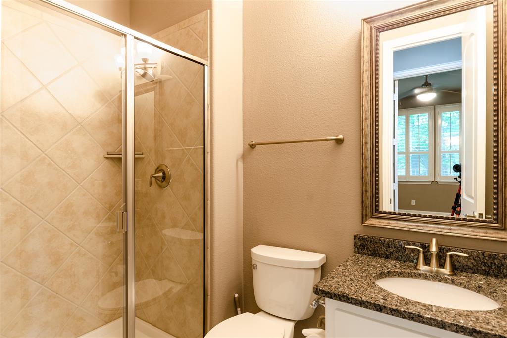1863 Audubon Pond Way Allen, TX 75013 - Photo 26 of 40 a bathroom with a granite countertop sink toilet and shower