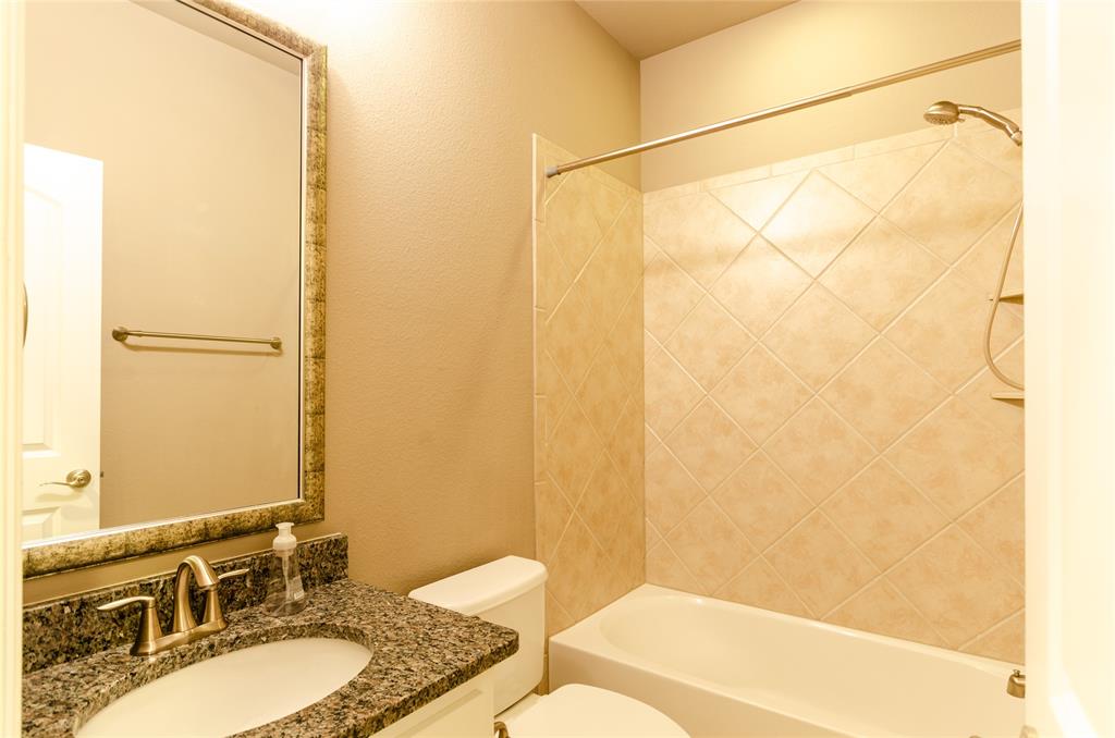 1863 Audubon Pond Way Allen, TX 75013 - Photo 32 of 40 a bathroom with a granite countertop sink and a mirror