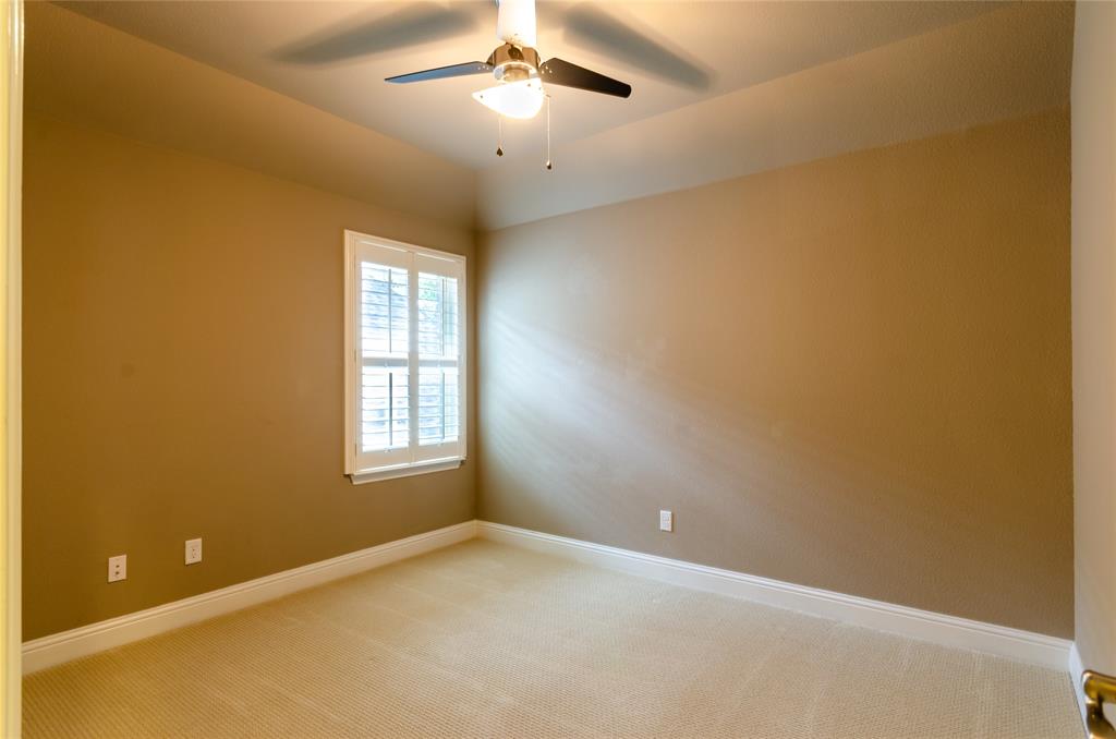 1863 Audubon Pond Way Allen, TX 75013 - Photo 33 of 40 en empty room with windows and chandelier fan