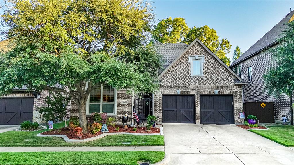 1863 Audubon Pond Way Allen, TX 75013 - Photo 37 of 40 a front view of a house with a yard and garage