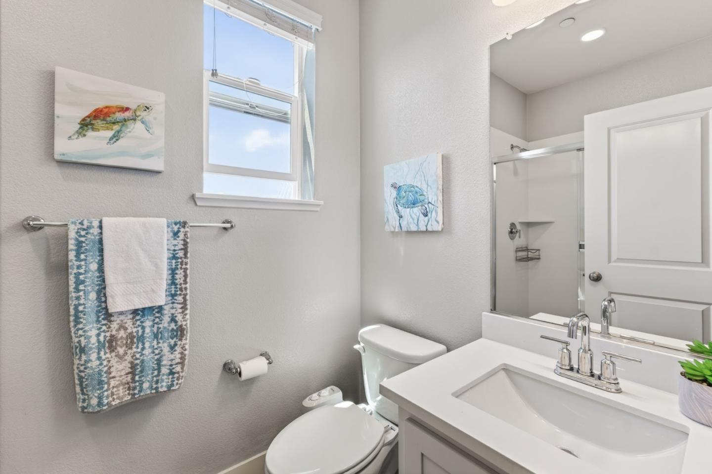 202 Market Street Milpitas, CA 95035 - Photo 22 of 30 a bathroom with a toilet a sink and mirror