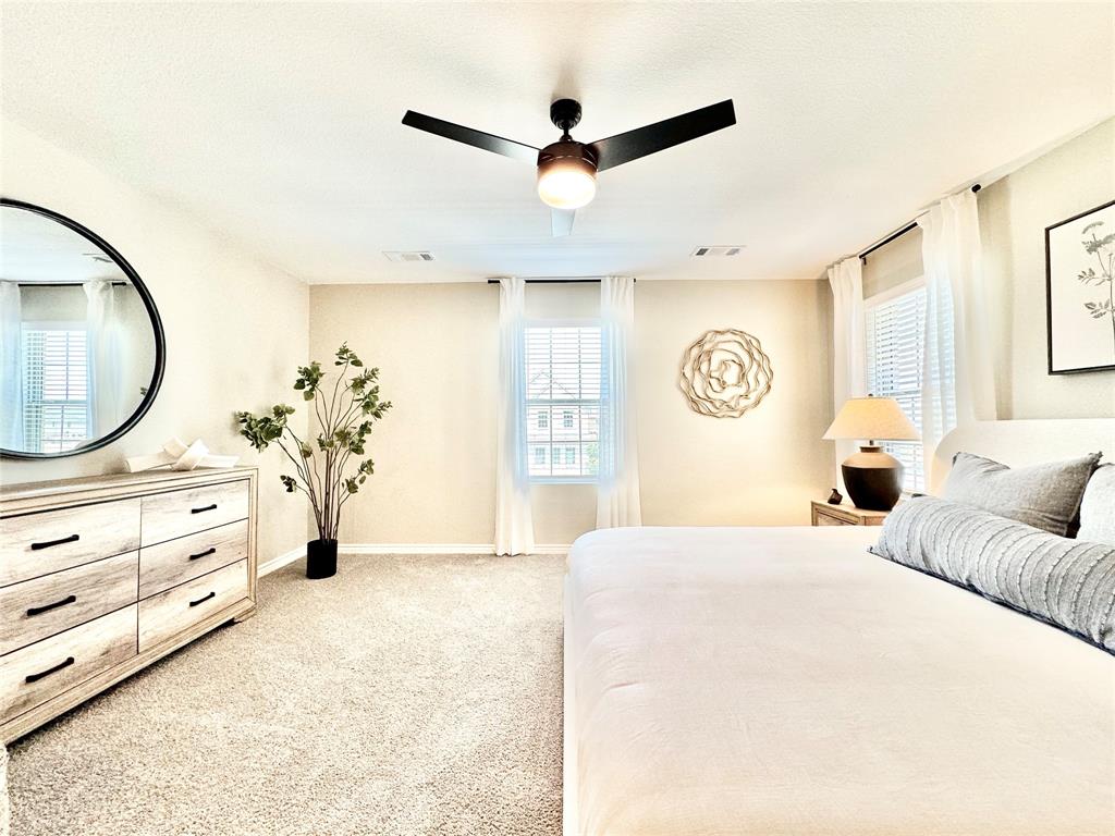 8523 Leyton Road The Colony, TX 75056 - Photo 18 of 39 a bedroom with a bed and a dresser