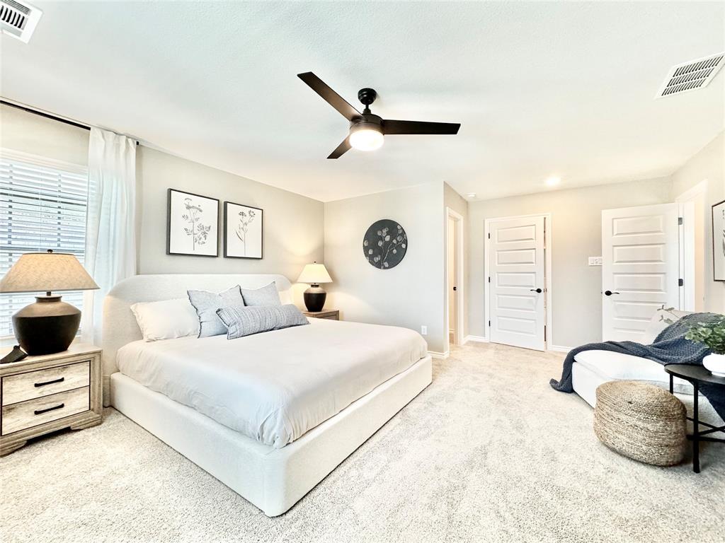 8523 Leyton Road The Colony, TX 75056 - Photo 19 of 39 a bedroom with a bed and wooden floor