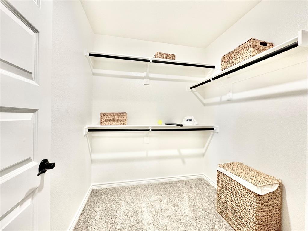 8523 Leyton Road The Colony, TX 75056 - Photo 21 of 39 a view of a walk in closet
