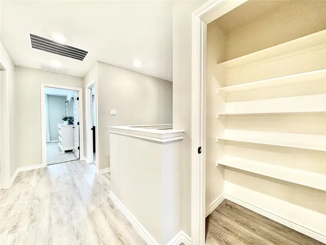 a view of a bedroom from the hallway