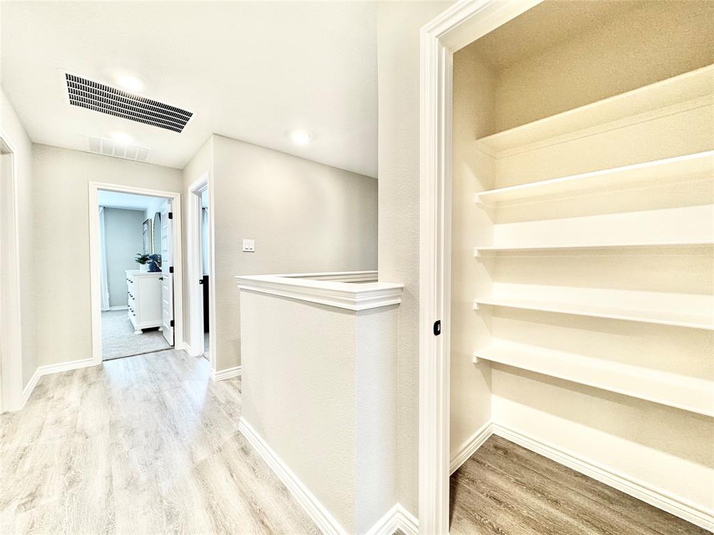 8523 Leyton Road The Colony, TX 75056 - Photo 26 of 39 a view of a bedroom from the hallway