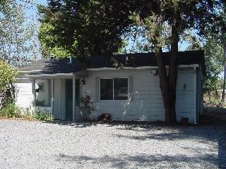 1743 Guerneville Road Santa Rosa, CA 95403 - Photo 2 of 5 a front view of a house with garden