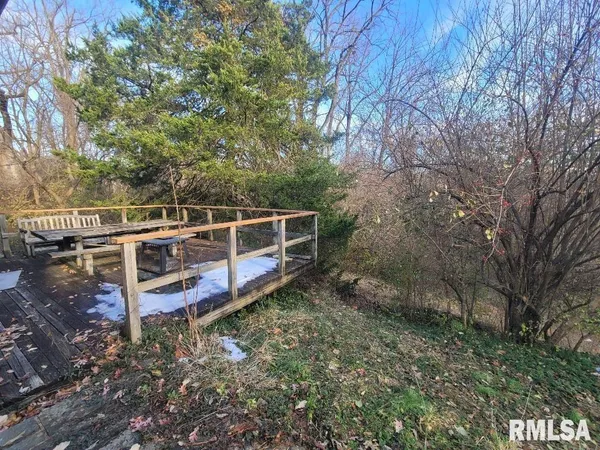 a view of a deck with a yard