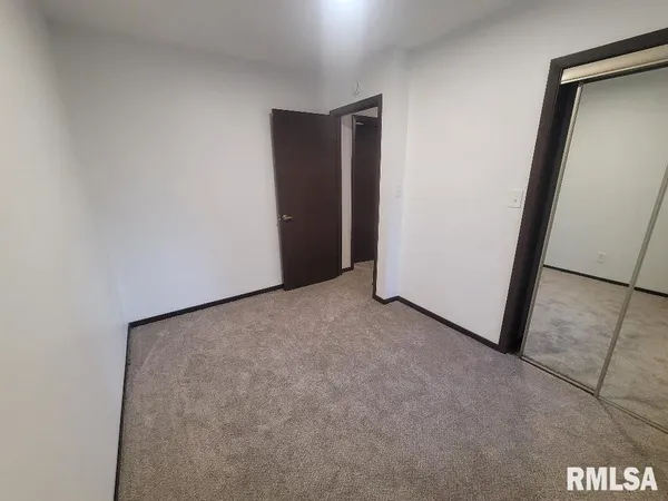 a work room with furniture and a window