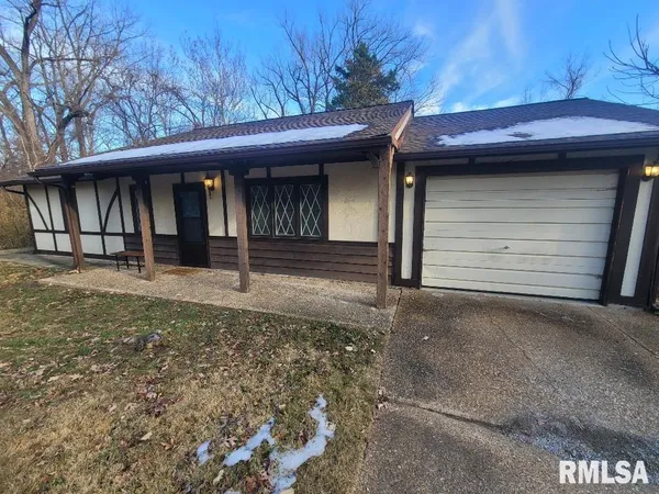 a view of a house with a garage