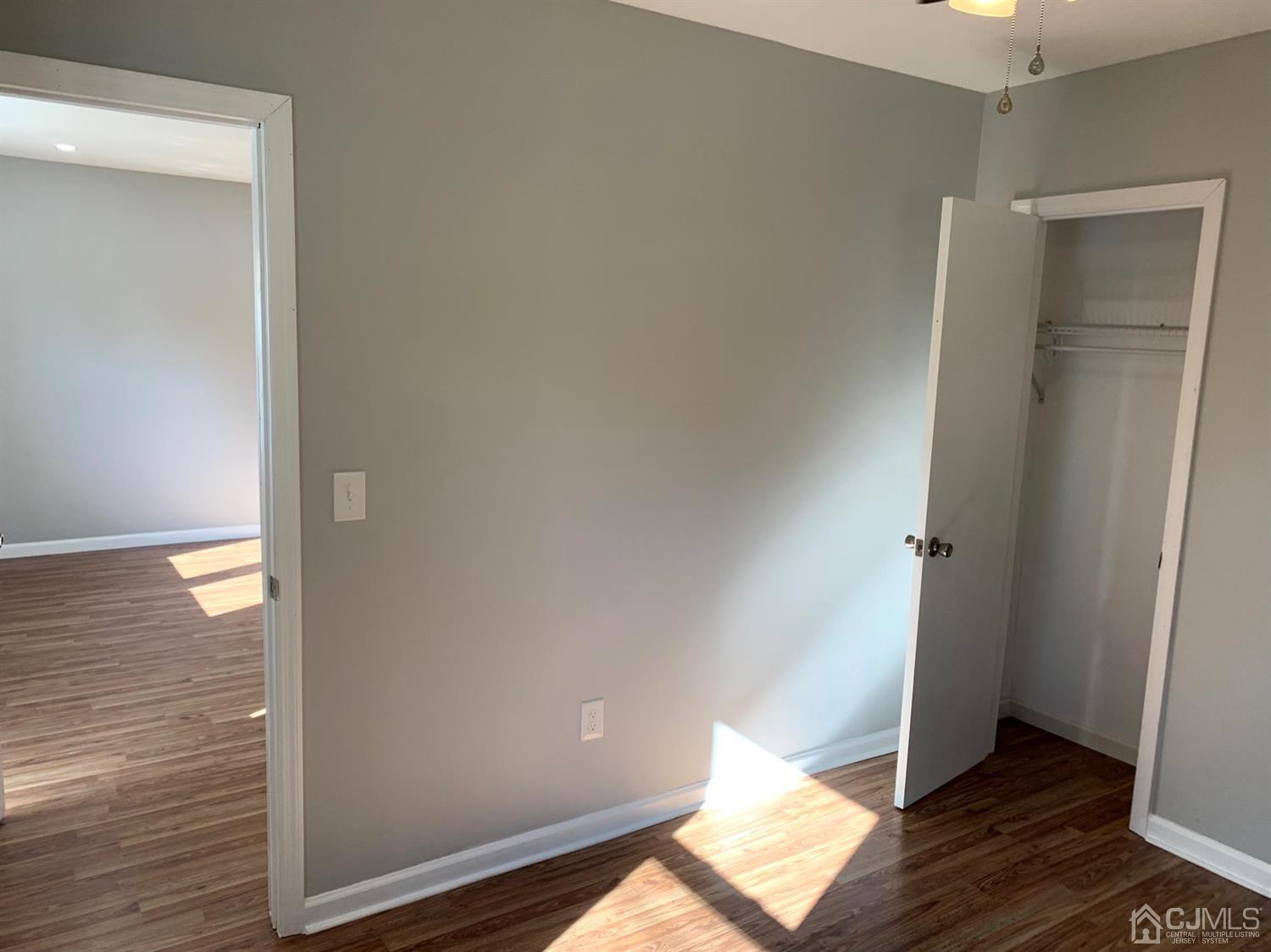 36 Brookside Road Spotswood, NJ 08884 - Photo 22 of 39 a view of an empty room and wooden floor
