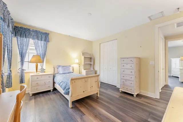 a room with bed and window