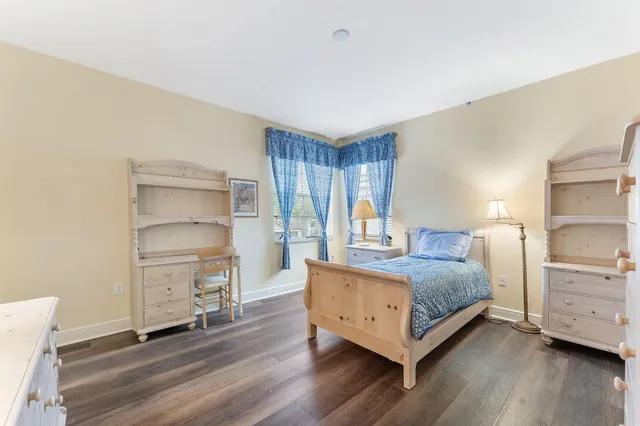 a living room with a bed and furniture