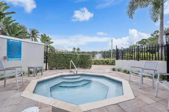 a view of a swimming pool with a patio