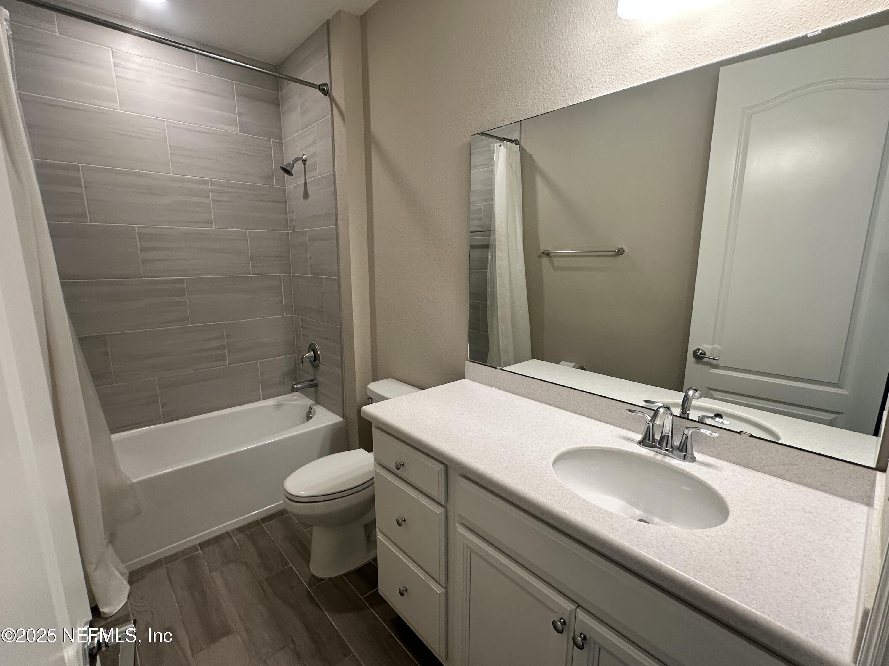 510 Broomsedge Circle St. Augustine, FL 32095 - Photo 14 of 28 a bathroom with a sink a toilet and shower