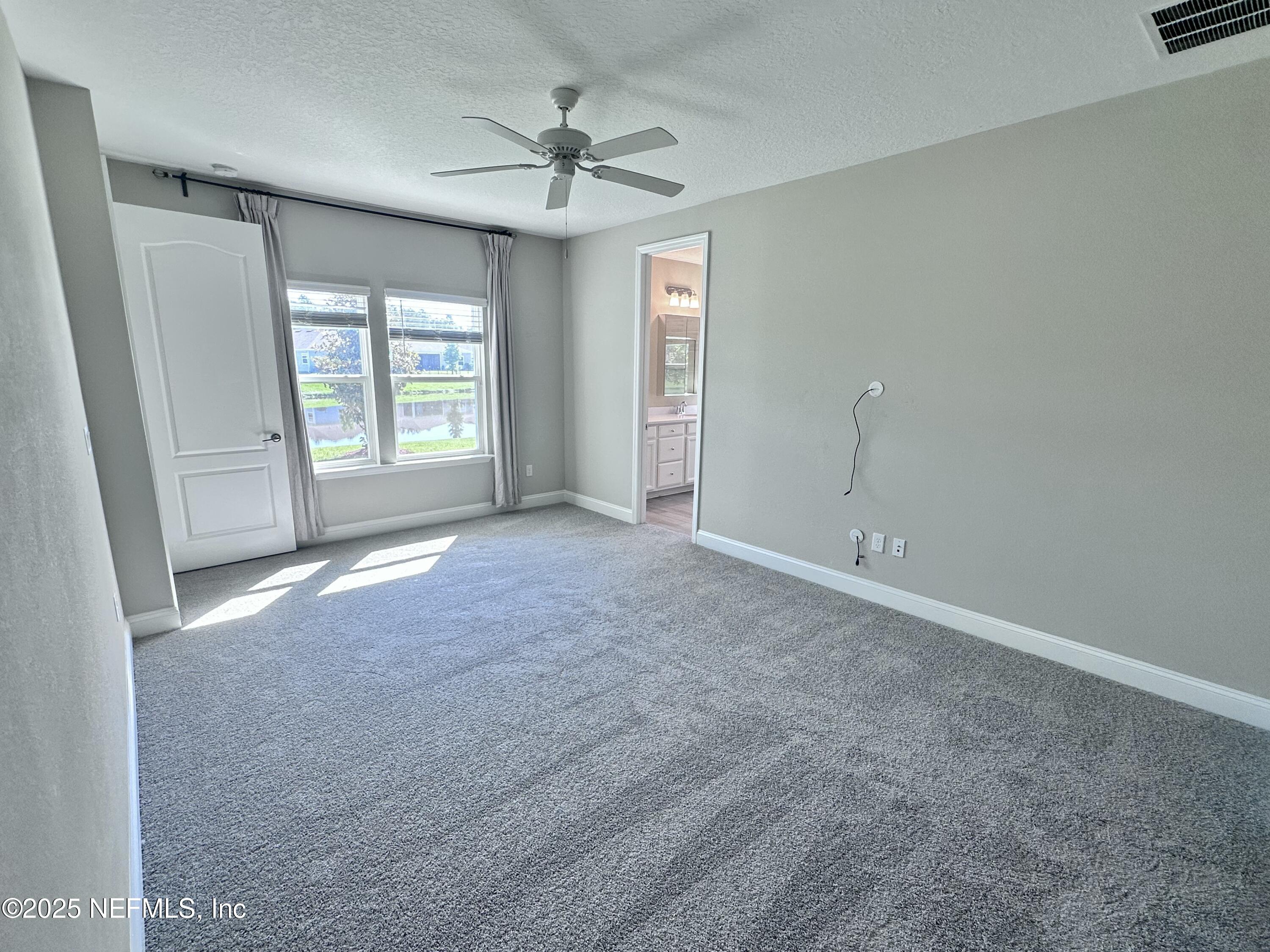 510 Broomsedge Circle St. Augustine, FL 32095 - Photo 18 of 28 a view of an empty room with a window
