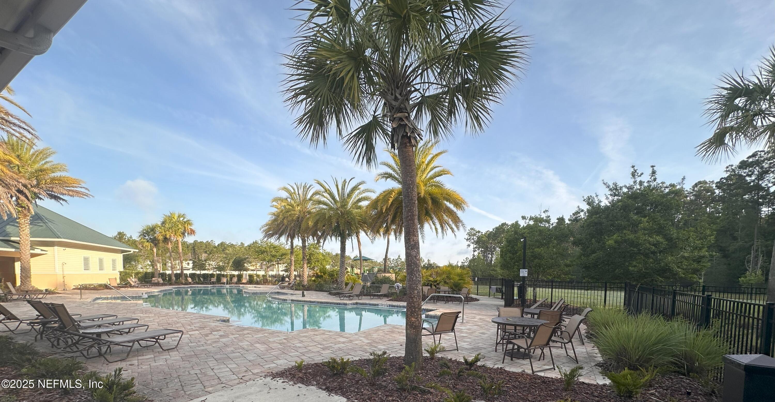 510 Broomsedge Circle St. Augustine, FL 32095 - Photo 26 of 28 a view of a yard with a patio