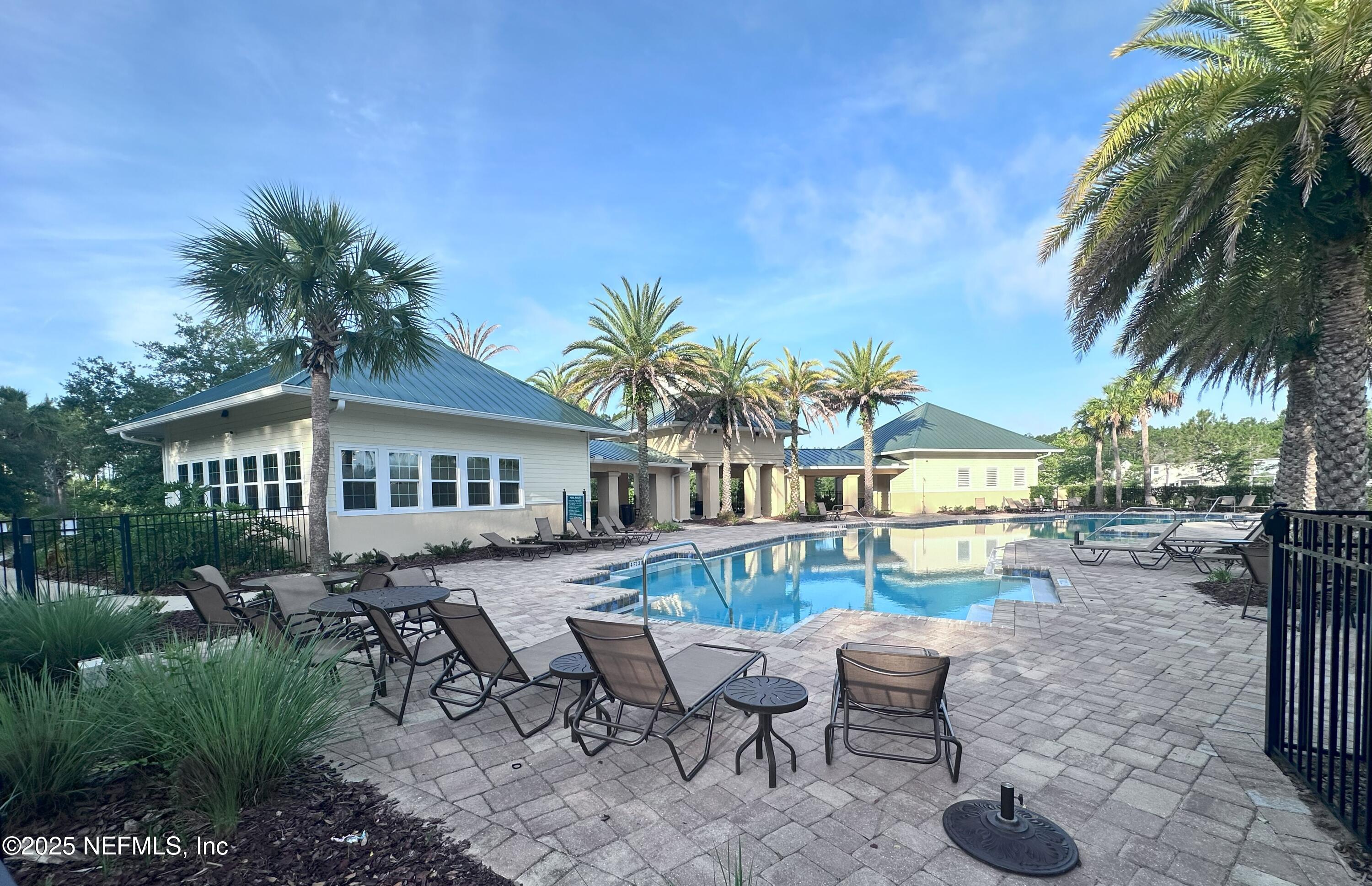 510 Broomsedge Circle St. Augustine, FL 32095 - Photo 27 of 28 a view of a house with backyard and sitting area