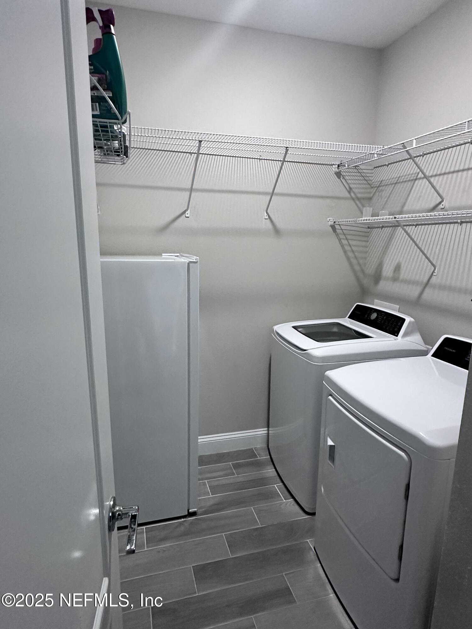 510 Broomsedge Circle St. Augustine, FL 32095 - Photo 6 of 28 a utility room with dryer and washer