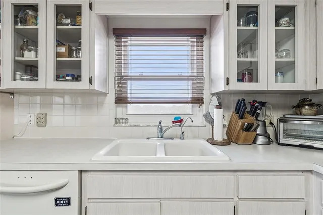 a living room with a book shelf and a book shelf