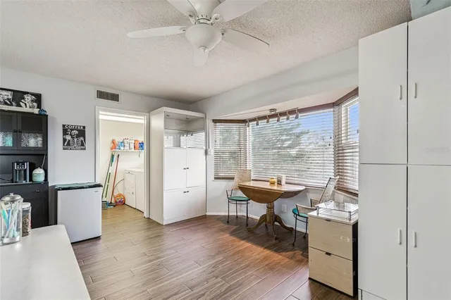 a view of a livingroom with furniture and a flat screen tv