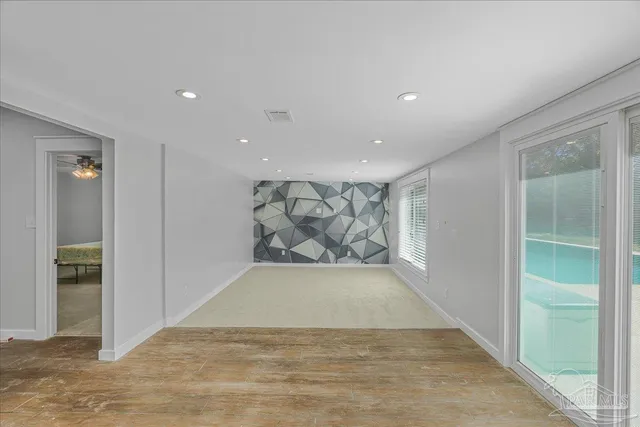 a view of an empty room with a window