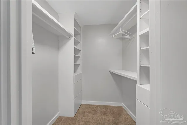 a view of hall way with furniture